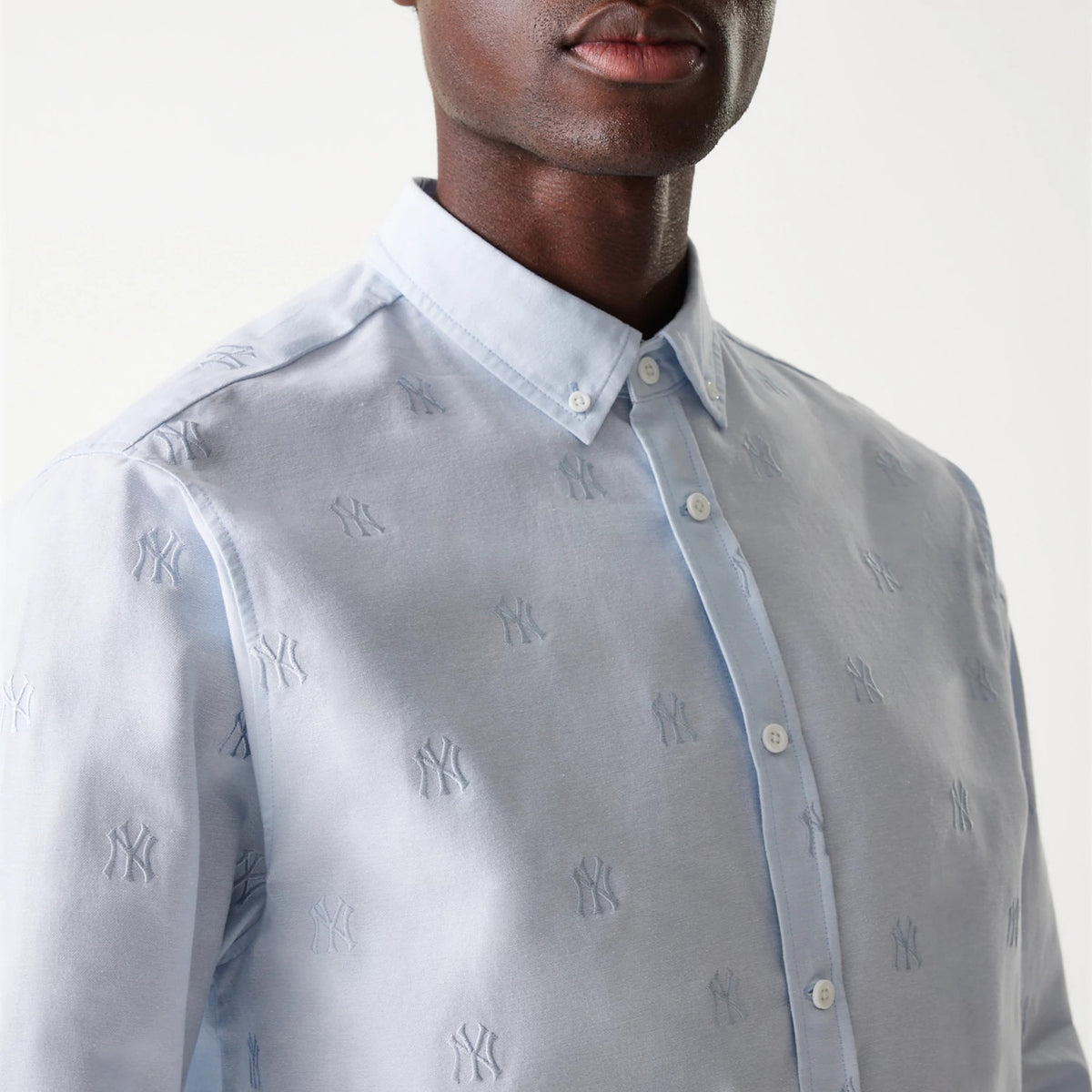 The Male model is wearing New York Yankees MLB Monogram Pastel Blue Long Sleeve Shirt 3