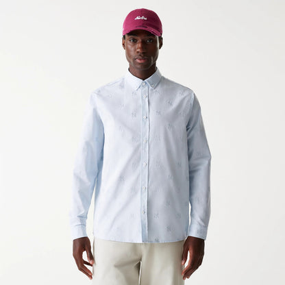 The Male model is wearing New York Yankees MLB Monogram Pastel Blue Long Sleeve Shirt 1