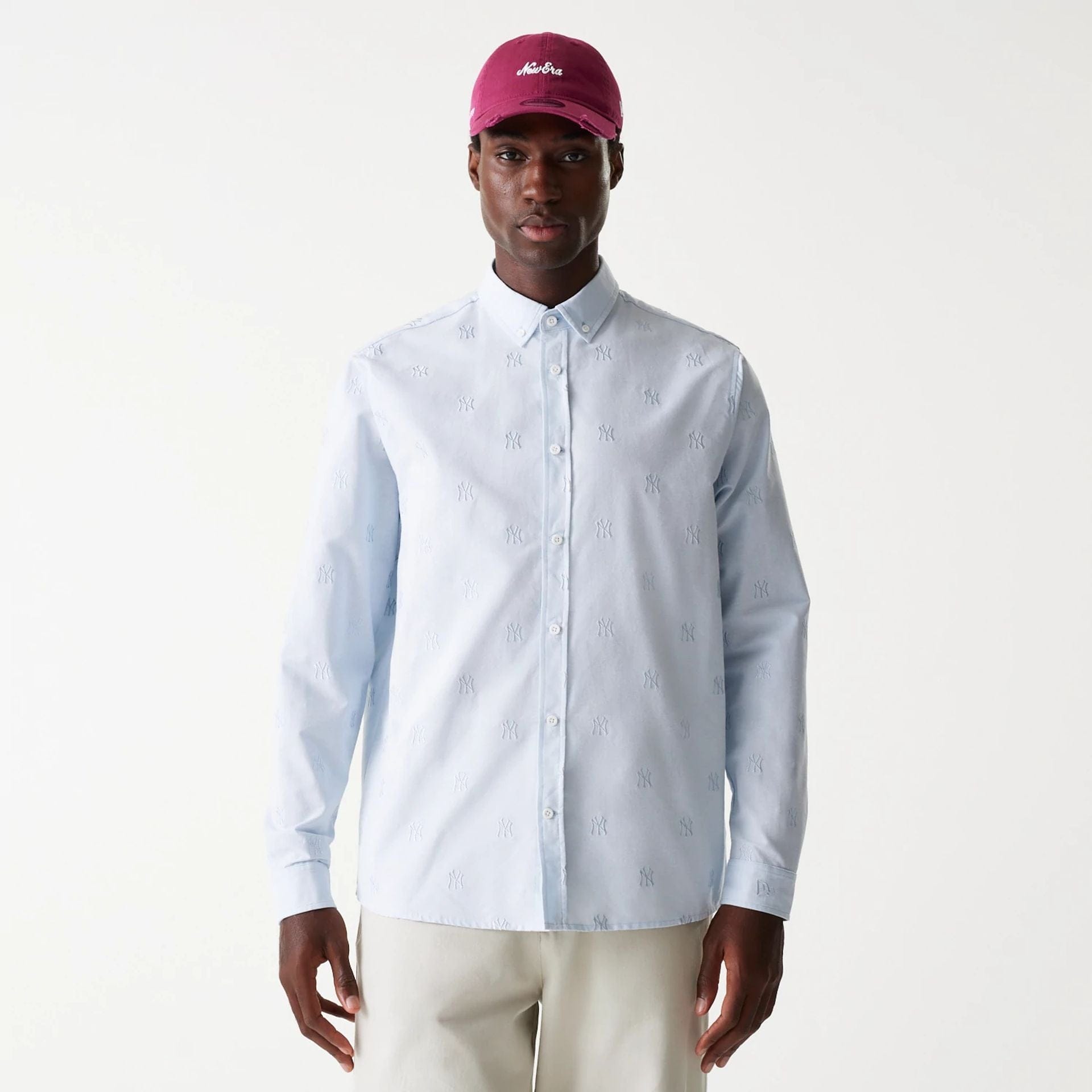 The Male model is wearing New York Yankees MLB Monogram Pastel Blue Long Sleeve Shirt 1