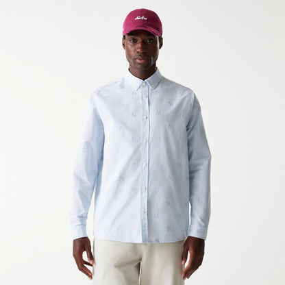 The Male model is wearing New York Yankees MLB Monogram Pastel Blue Long Sleeve Shirt 1