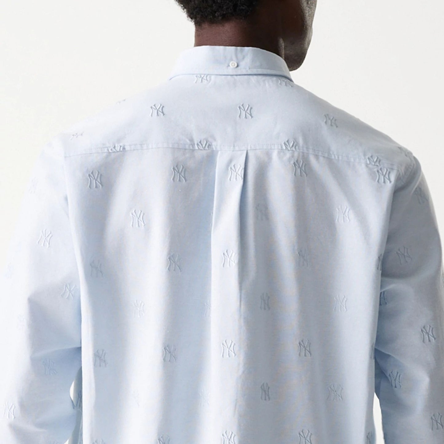 The Male model is wearing New York Yankees MLB Monogram Pastel Blue Long Sleeve Shirt 5