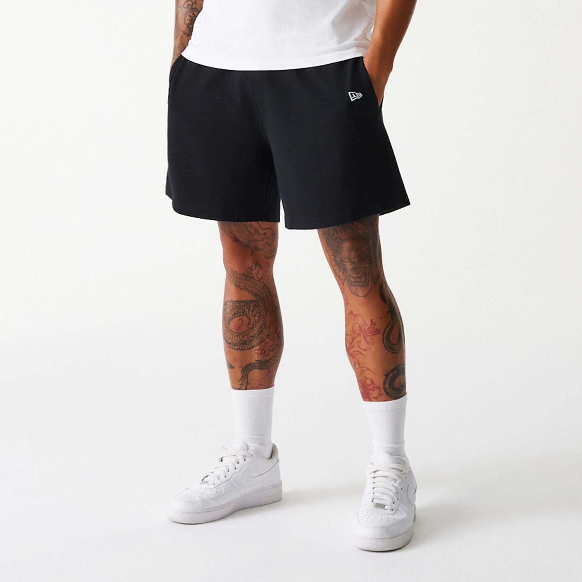 The Male model is wearing LA Dodgers MLB Pique Black Shorts 7