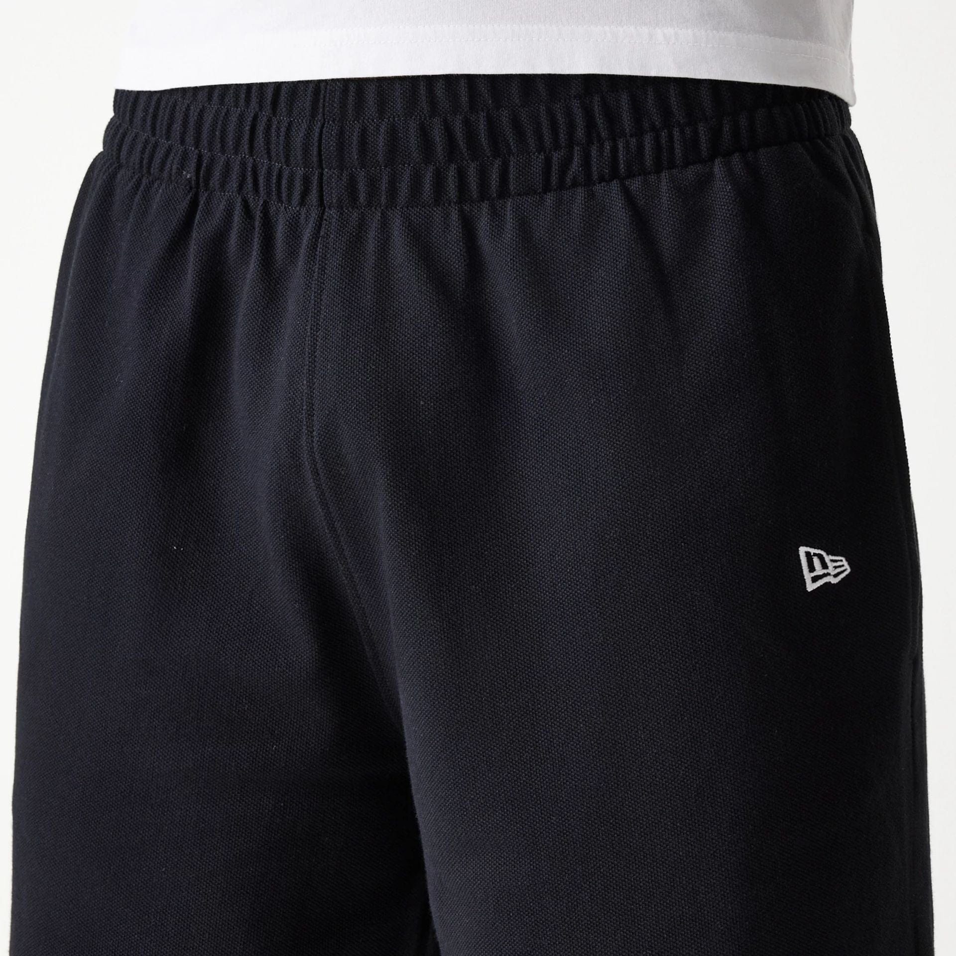 The Male model is wearing LA Dodgers MLB Pique Black Shorts 5