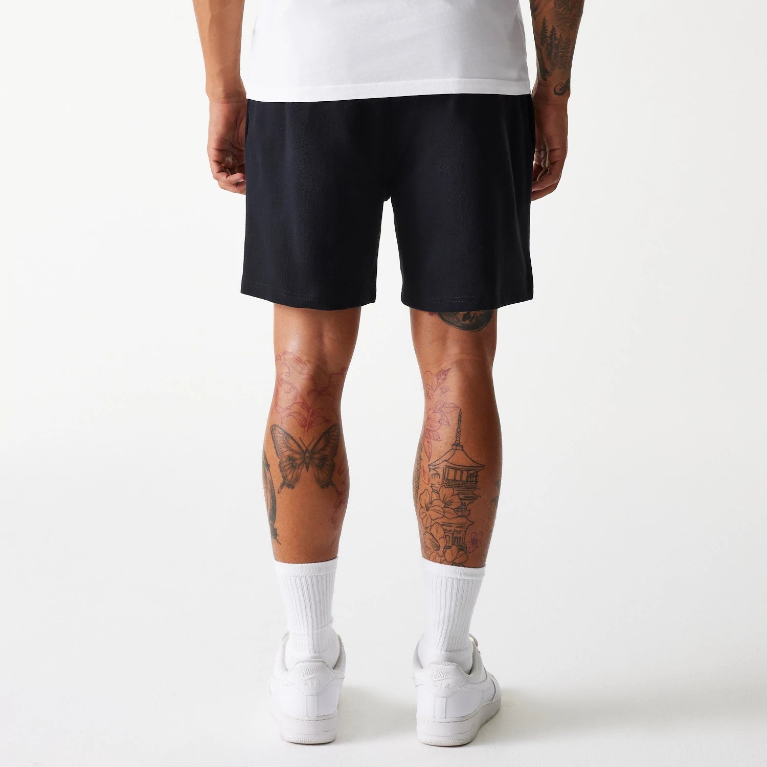The Male model is wearing LA Dodgers MLB Pique Black Shorts 2