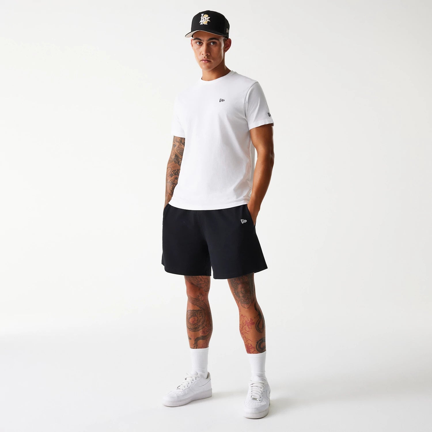 The Male model is wearing LA Dodgers MLB Pique Black Shorts 8