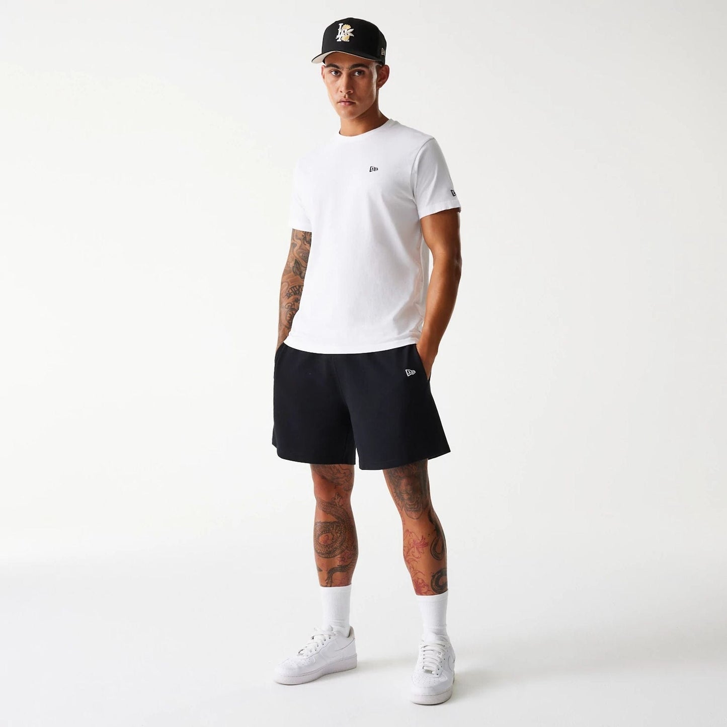 The Male model is wearing LA Dodgers MLB Pique Black Shorts 8