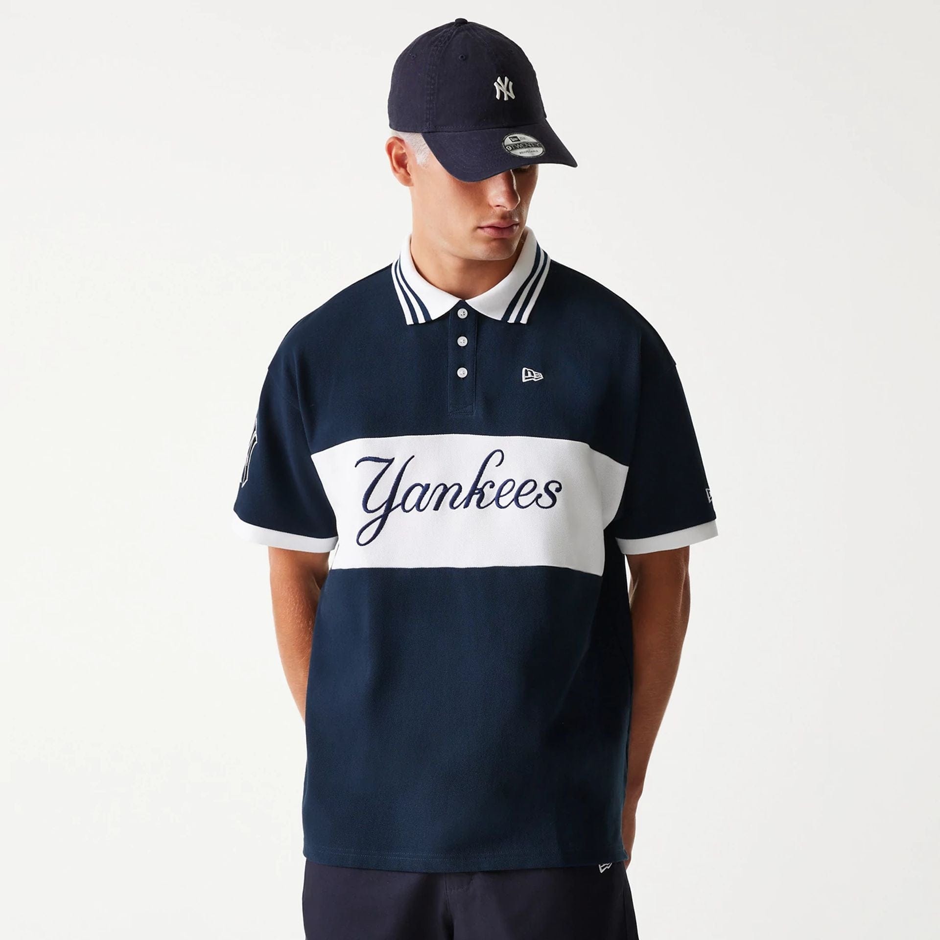 The Male model is wearing New York Yankees MLB Graphic Navy Polo Shirt 1