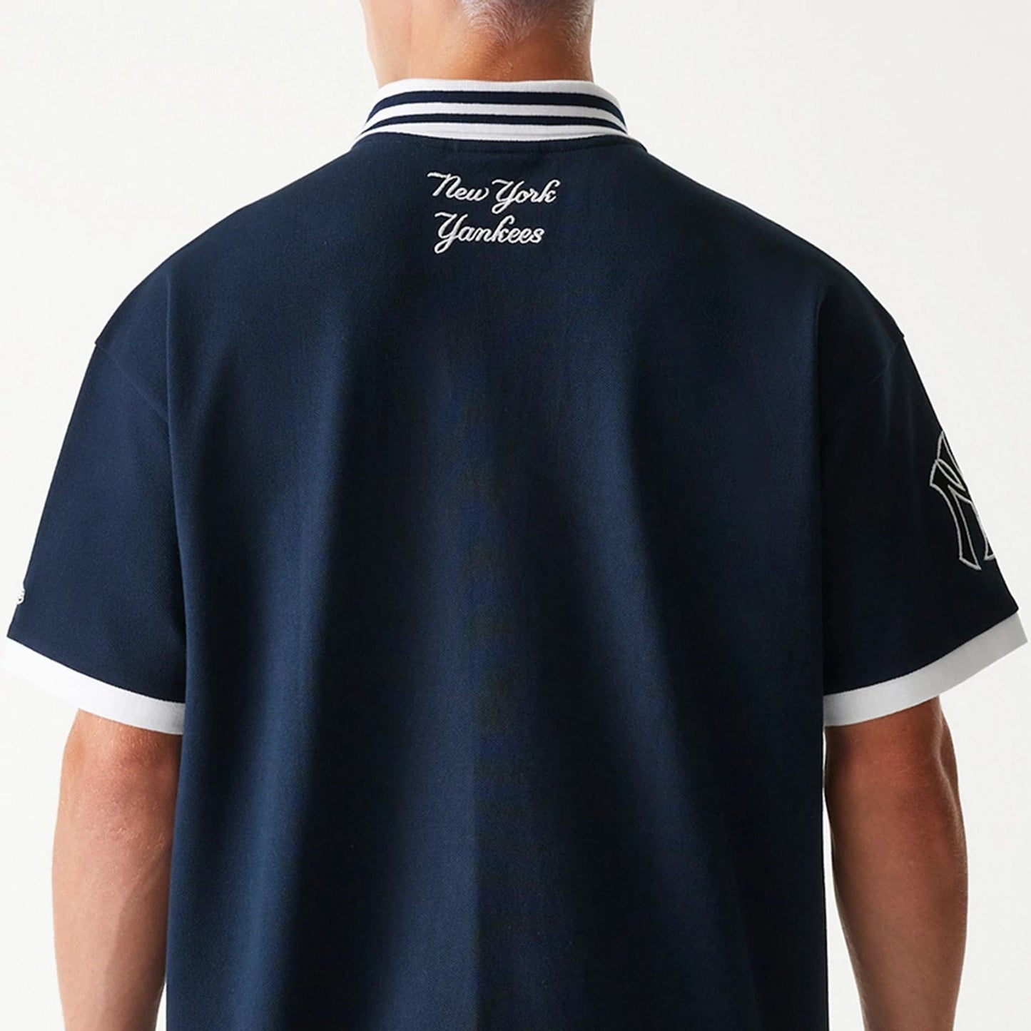 The Male model is wearing New York Yankees MLB Graphic Navy Polo Shirt 4