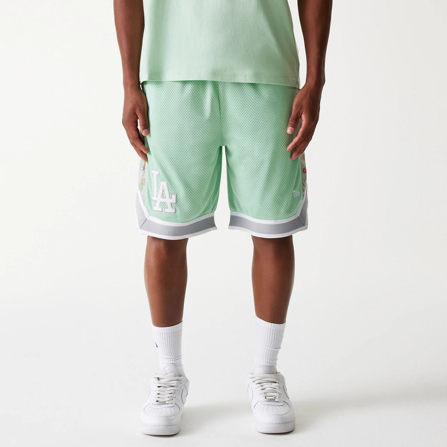 The Male model is wearing LA Dodgers MLB Infill Pastel Green Mesh Shorts 1