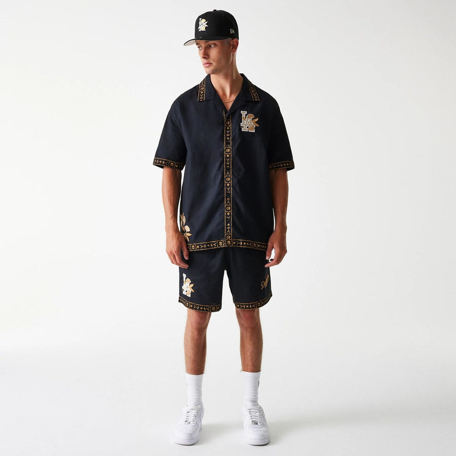 The Male model is wearing LA Dodgers MLB Taping Black Short Sleeve Shirt 7