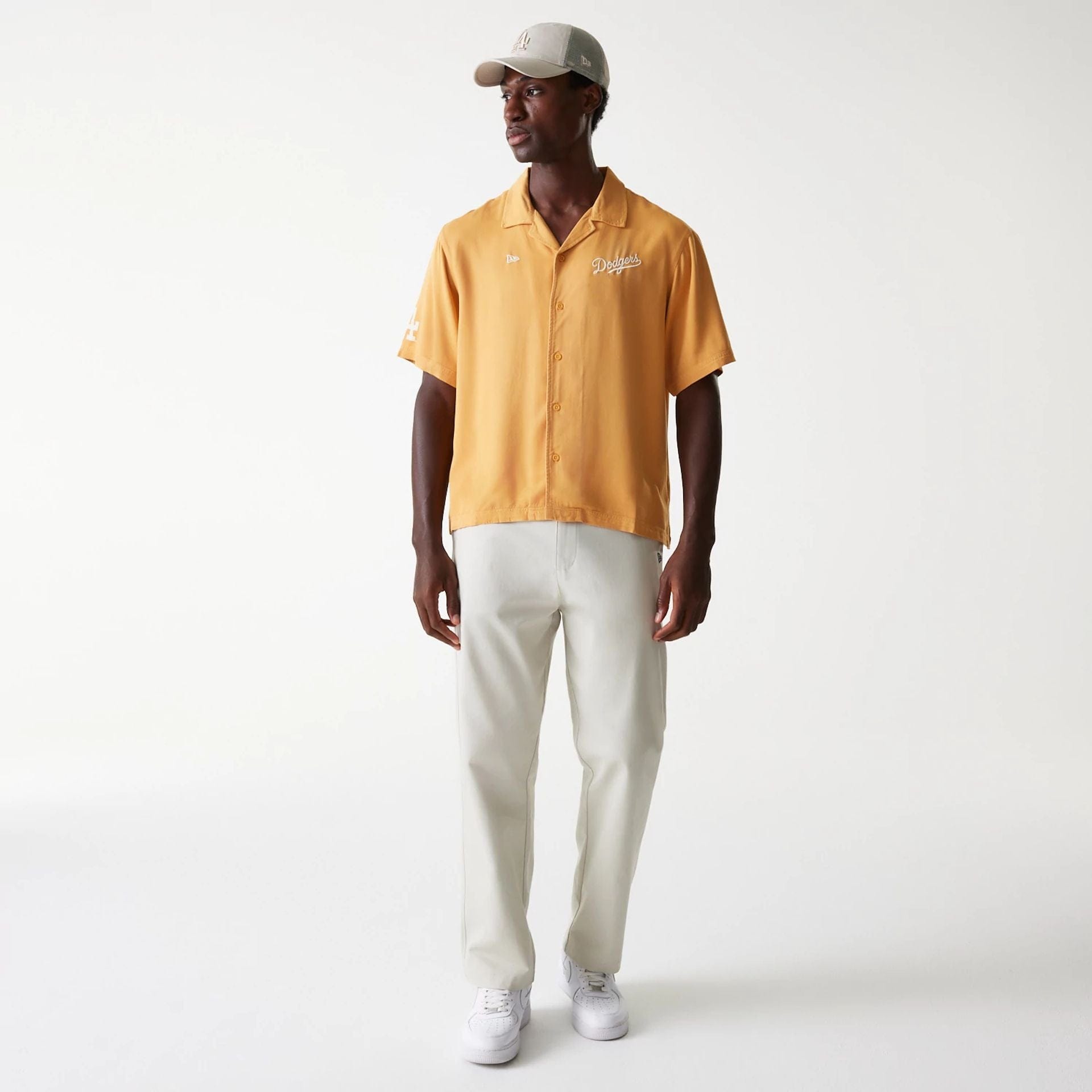 The Male model is wearing LA Dodgers MLB Graphic Beige Revere Short Sleeve Shirt 8