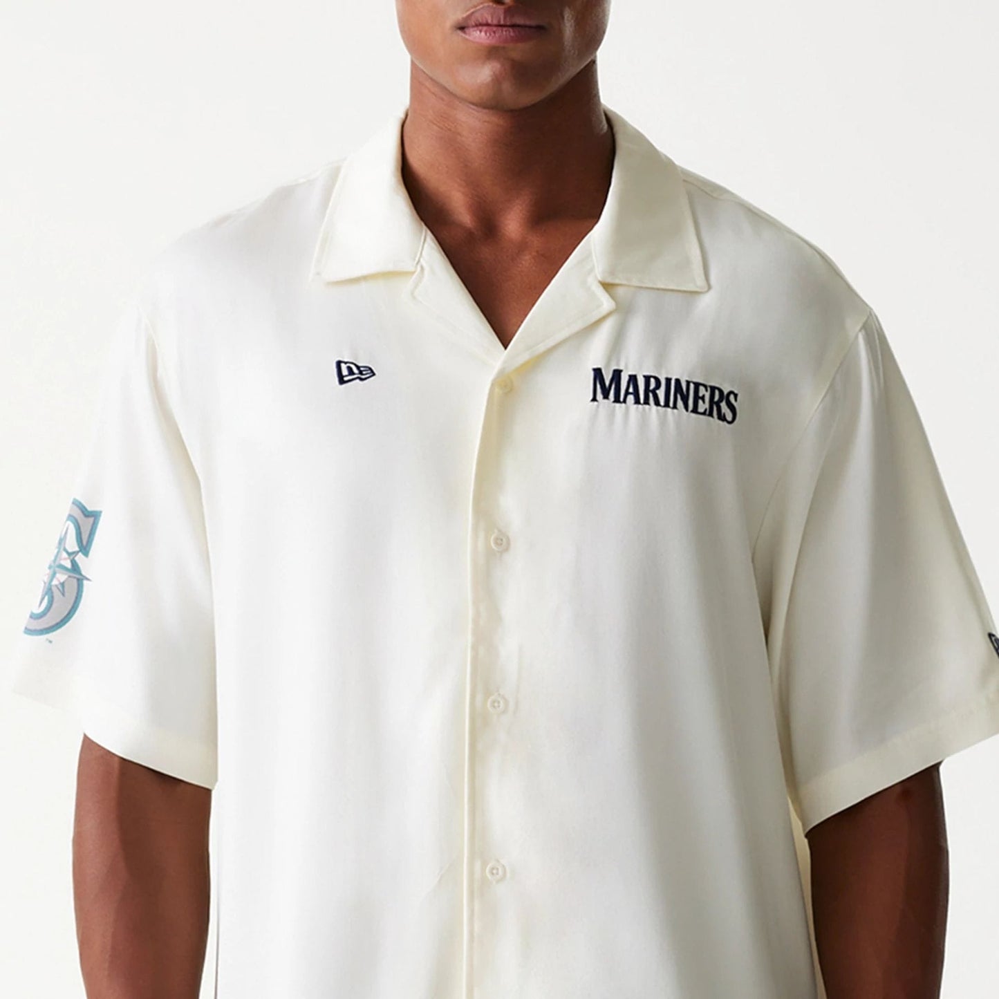 The Male model is wearing Seattle Mariners MLB Graphic Open White Revere Short Sleeve Shirt 3