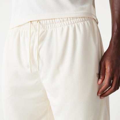 New Era LA Lakers NBA Tonal Open White Mesh Shorts, side view showing the elasticated waistband with drawstrings, a debossed logo on the left side, and a white mesh texture.