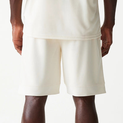 New Era LA Lakers NBA Tonal Open White Mesh Shorts, rear view showing the plain white mesh fabric, loose fit with a wide waistband, and the hems falling just above the knee.