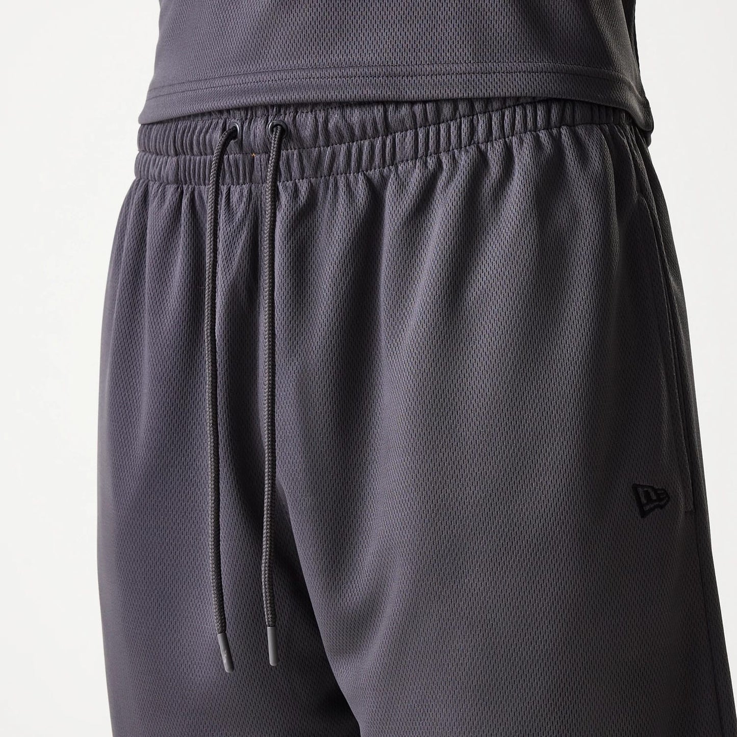 The Male model is wearing Chicago Bulls NBA Tonal Dark Grey Mesh Shorts 6