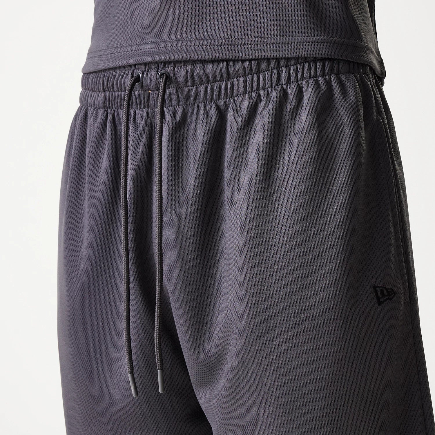 The Male model is wearing Chicago Bulls NBA Tonal Dark Grey Mesh Shorts 6