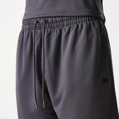 New Era Chicago Bulls NBA Tonal Dark Grey Mesh Shorts, front view showing the elastic waistband with adjustable drawstrings, and an embossed New Era logo positioned on the lower right side.