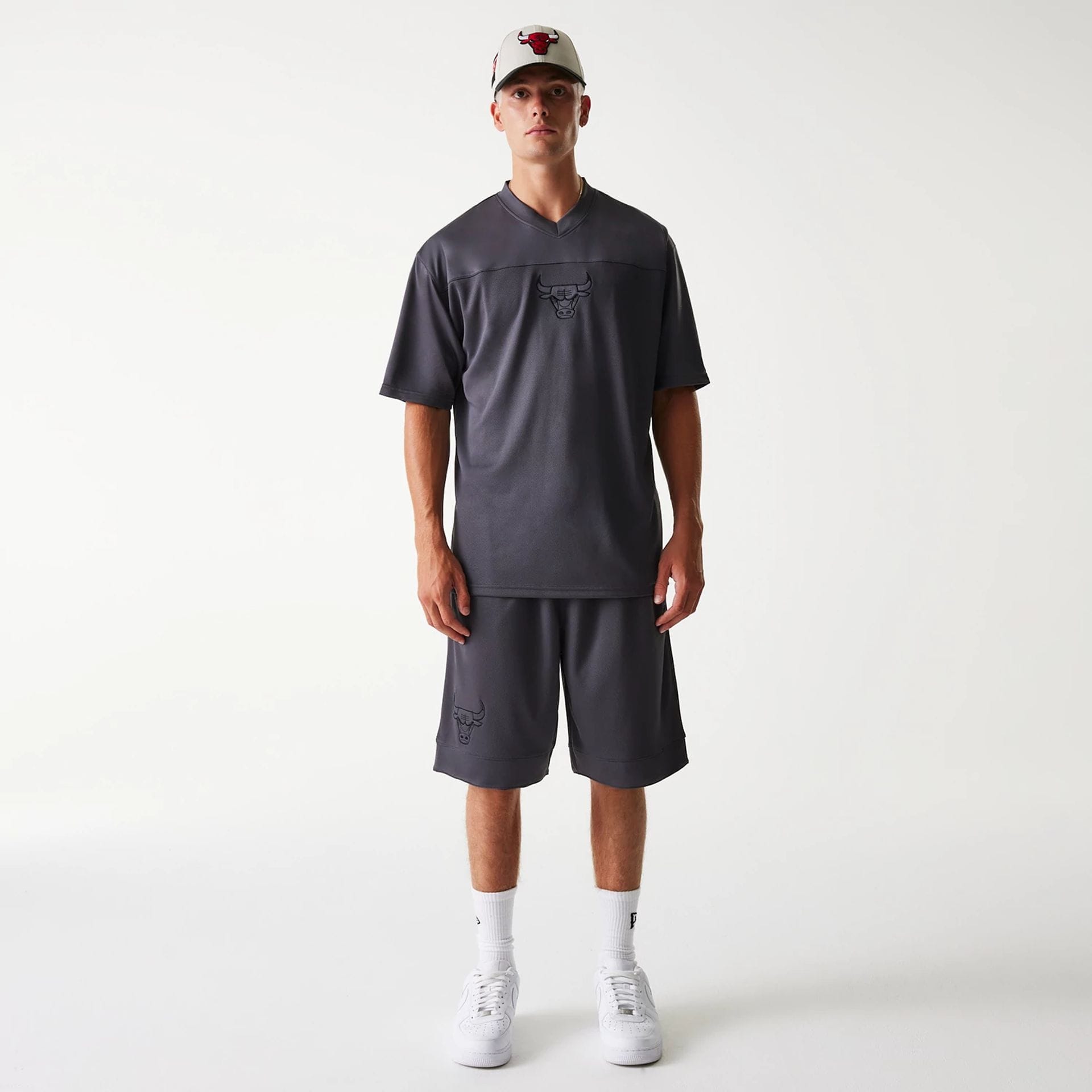 The Male model is wearing Chicago Bulls NBA Tonal Dark Grey Mesh Shorts 8