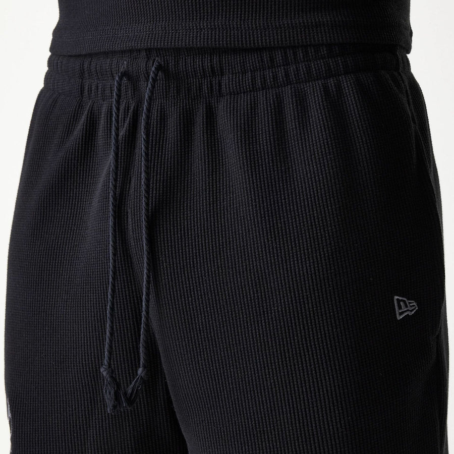 The Male model is wearing Chicago Bulls NBA Waffle Black Shorts 5