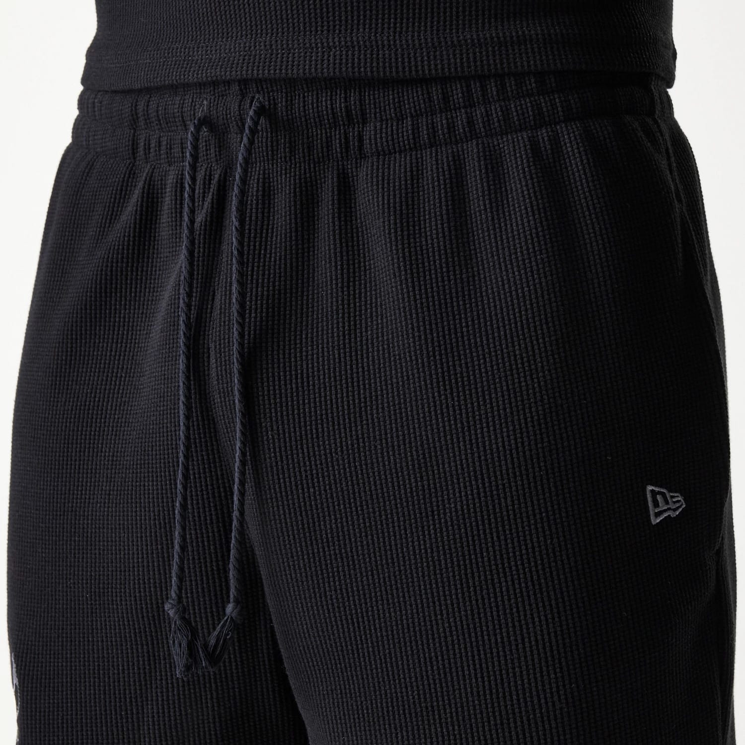 The Male model is wearing Chicago Bulls NBA Waffle Black Shorts 5