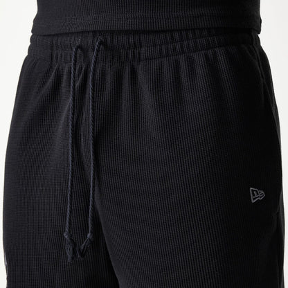 The Male model is wearing Chicago Bulls NBA Waffle Black Shorts 5