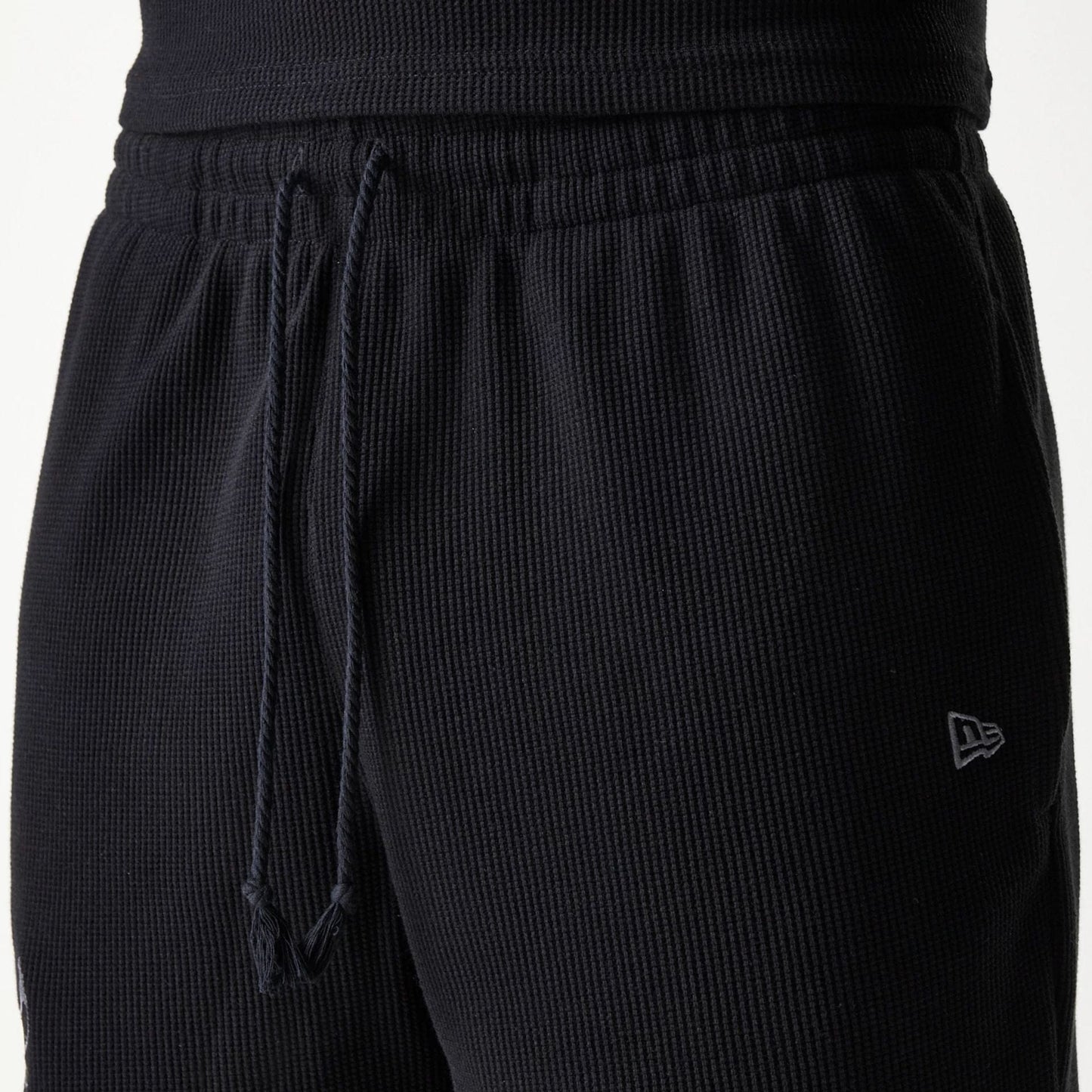 The Male model is wearing Chicago Bulls NBA Waffle Black Shorts 5