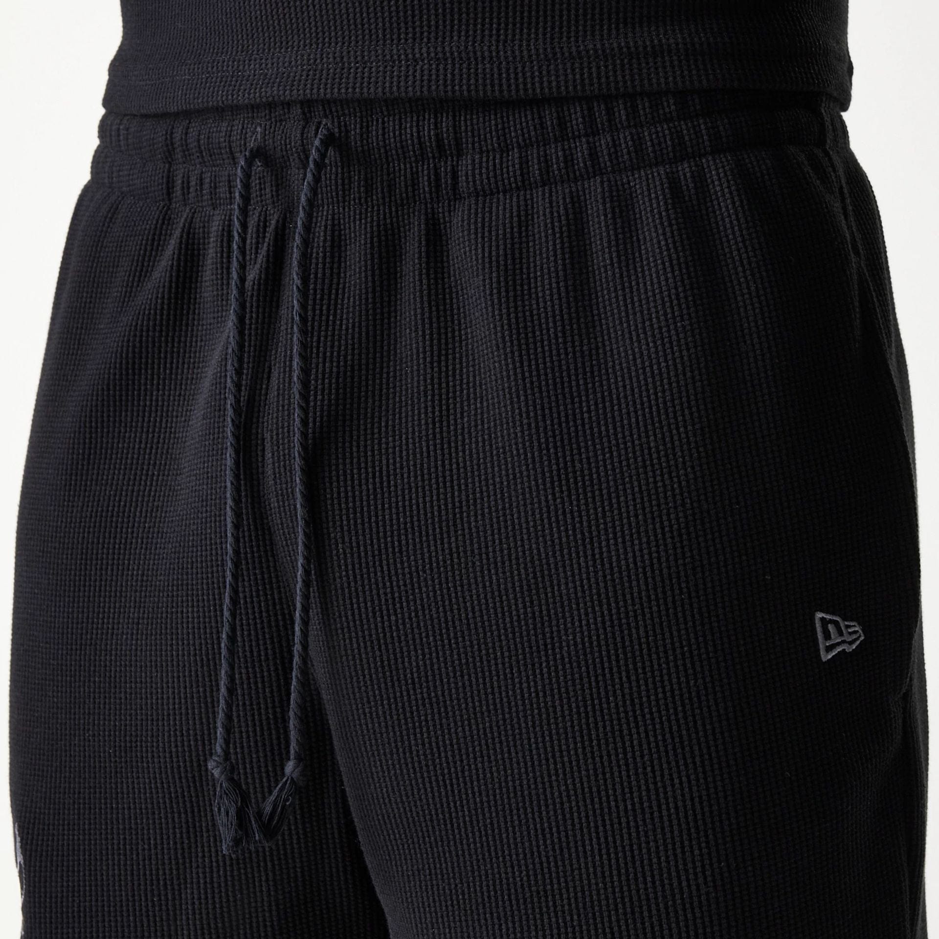 The Male model is wearing Chicago Bulls NBA Waffle Black Shorts 5