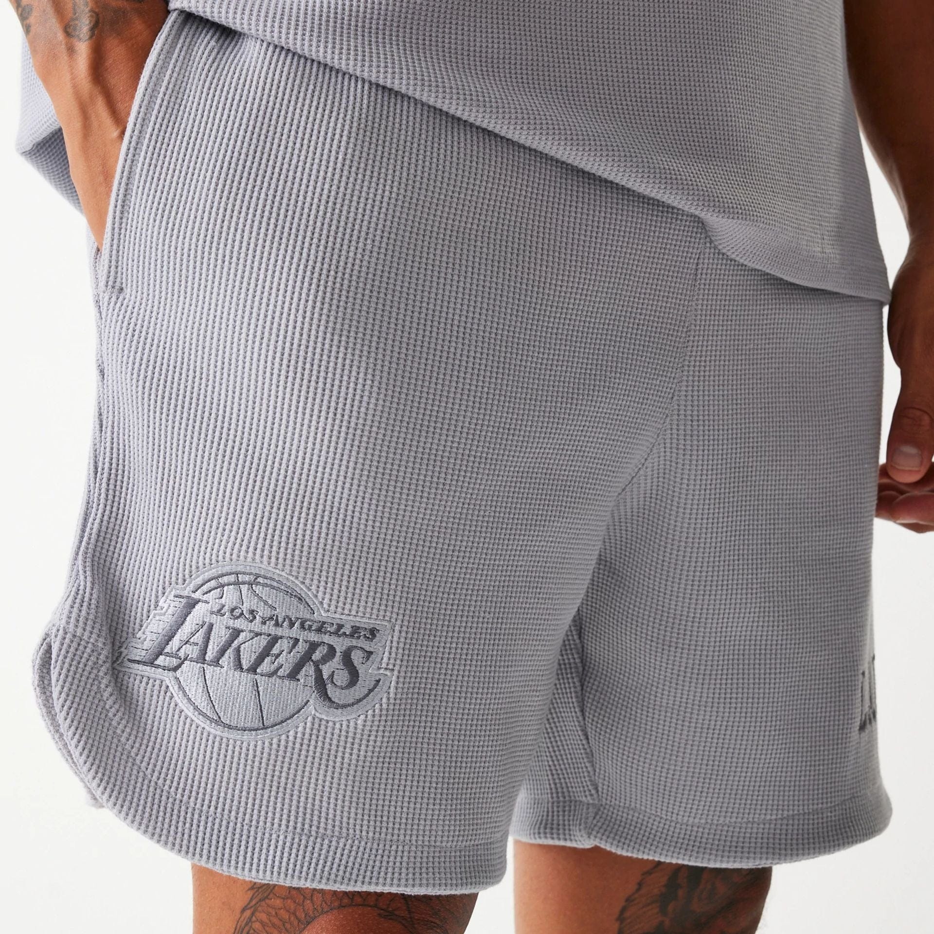 The Male model is wearing LA Lakers NBA Waffle Grey Shorts 3