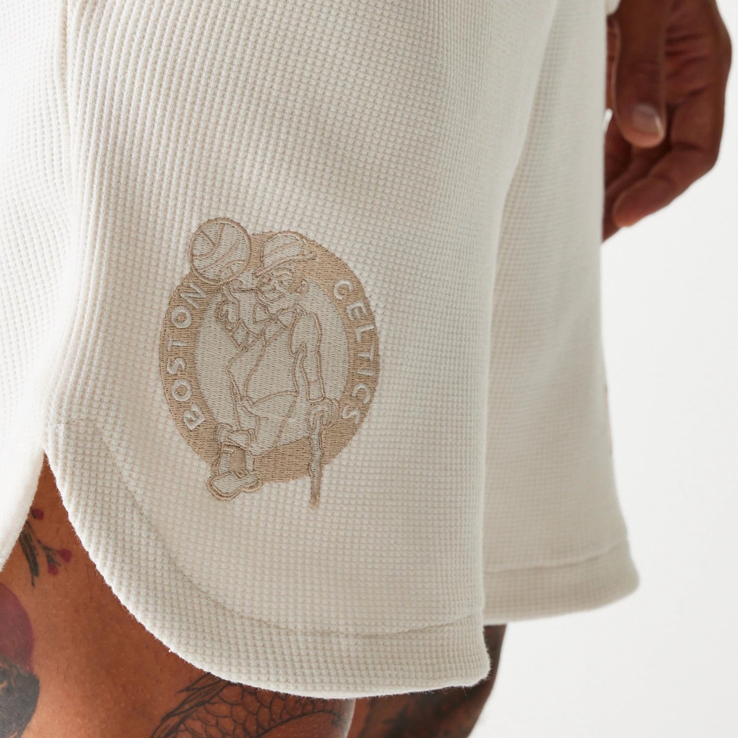 The Male model is wearing Boston Celtics NBA Waffle Open White Shorts 3