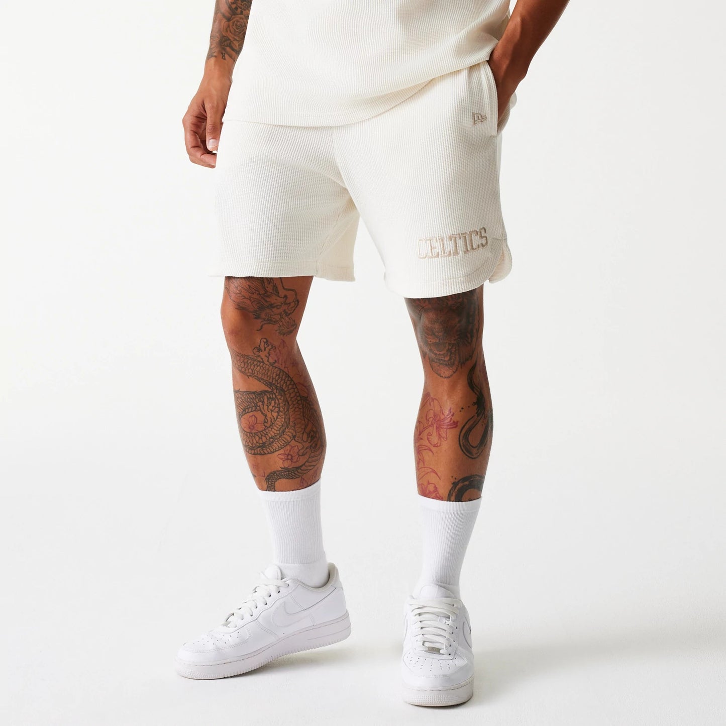 The Male model is wearing Boston Celtics NBA Waffle Open White Shorts 1