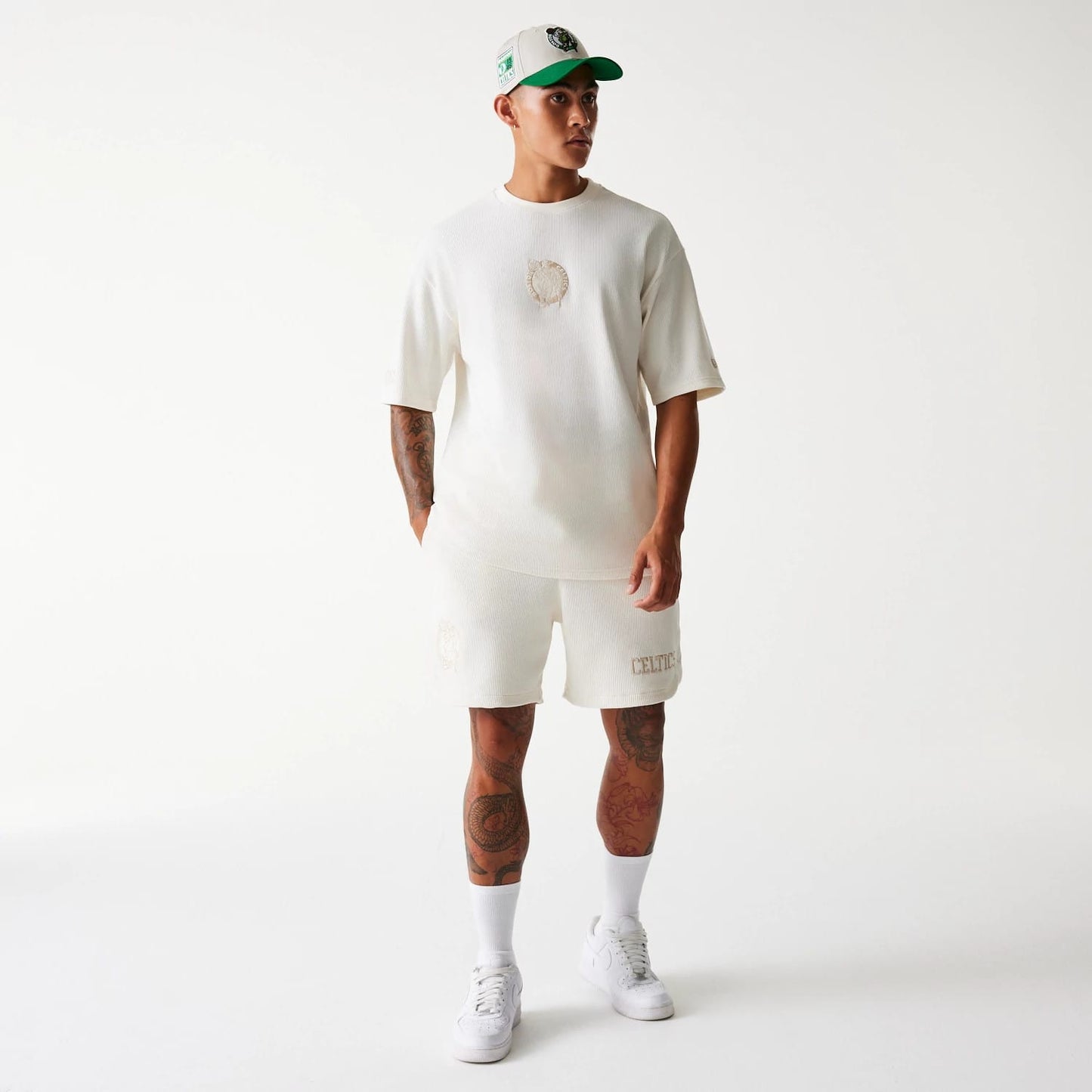 The Male model is wearing Boston Celtics NBA Waffle Open White Shorts 7