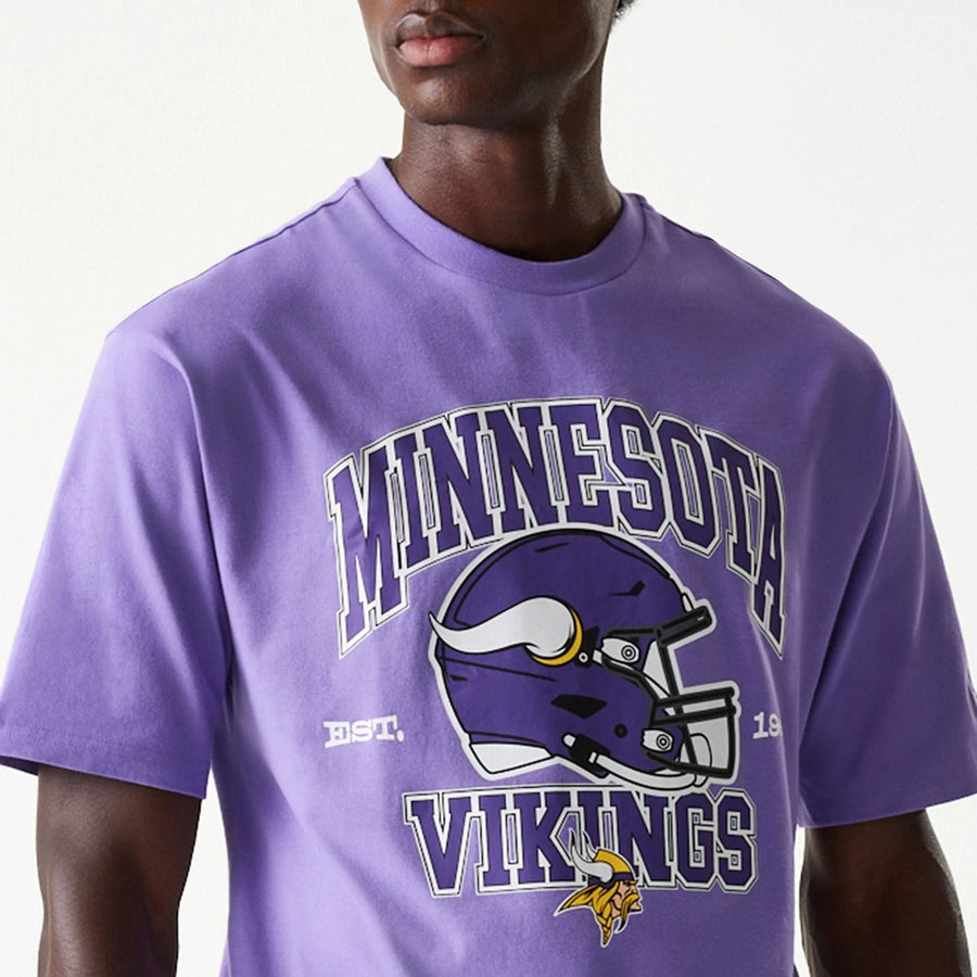 The Male model is wearing Minnesota Vikings NFL Helmet Purple Oversized T-Shirt 6