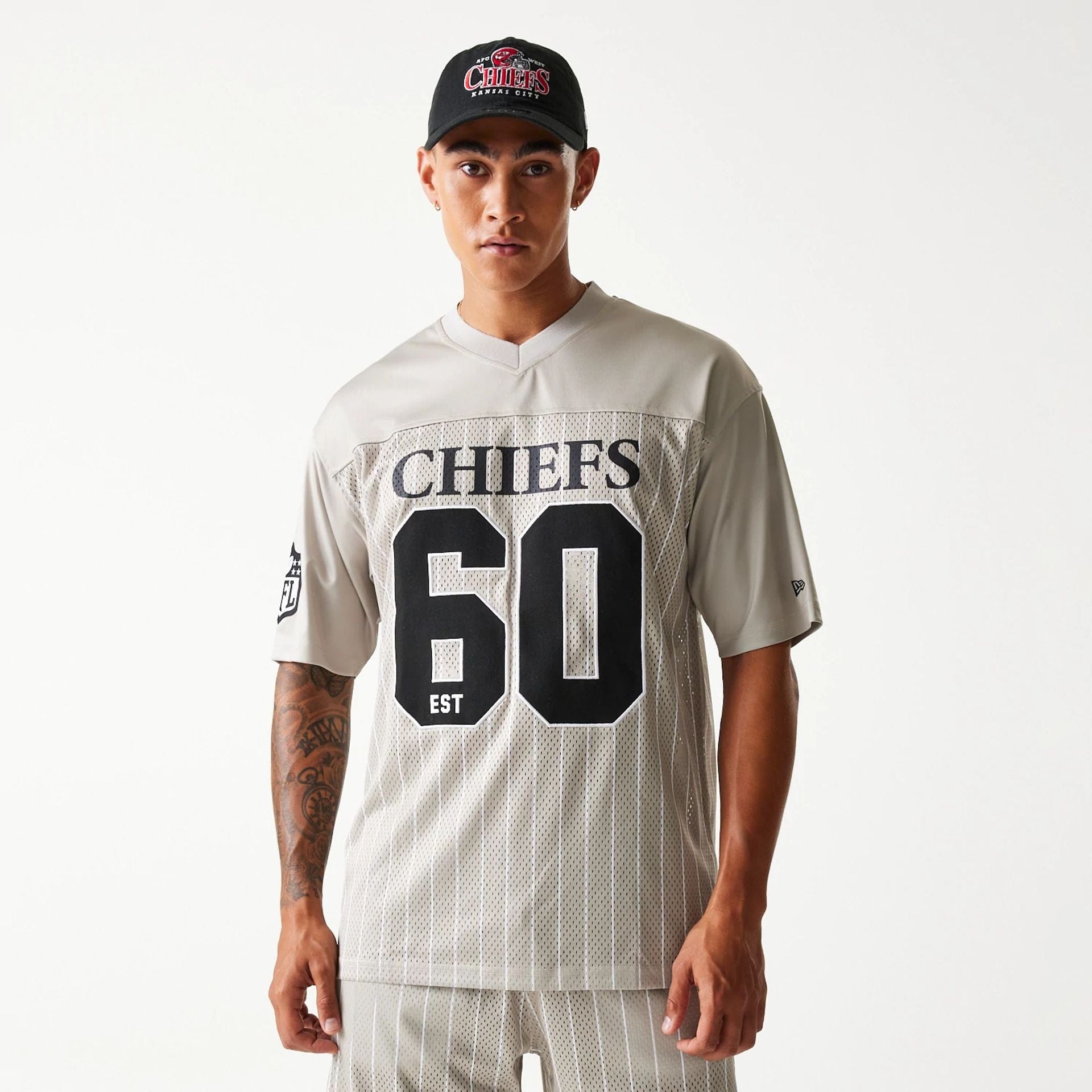 The Male model is wearing Kansas City Chiefs NFL Pinstripe Cream Mesh Jersey 1