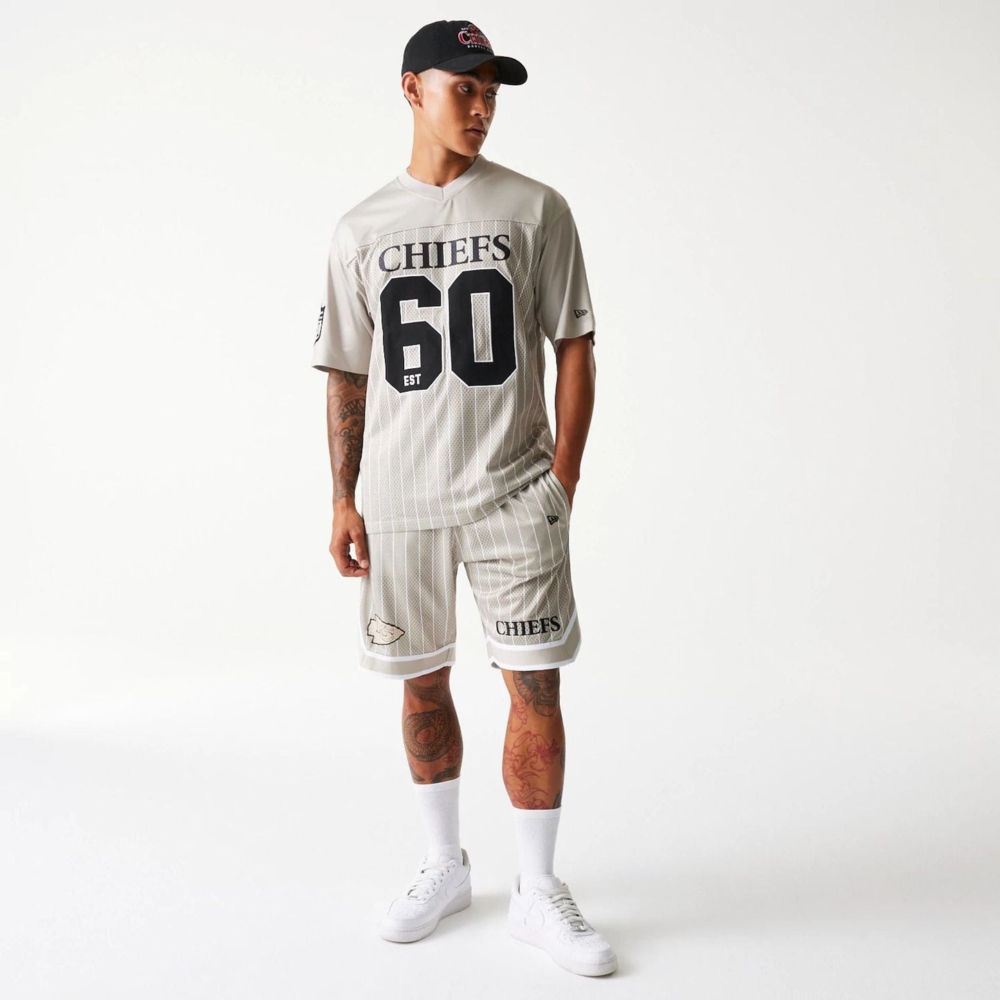 The Male model is wearing Kansas City Chiefs NFL Pinstripe Cream Shorts 8