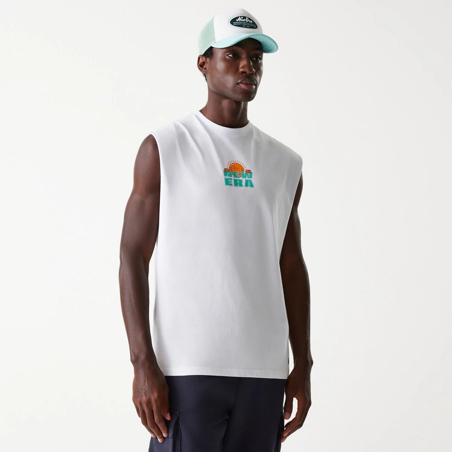 The Male model is wearing New Era Outdoor Graphic White Sleeveless T-Shirt 1