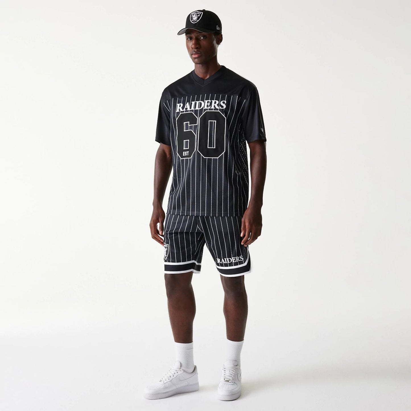 The Male model is wearing Las Vegas Raiders NFL Pinstripe Black Shorts 8