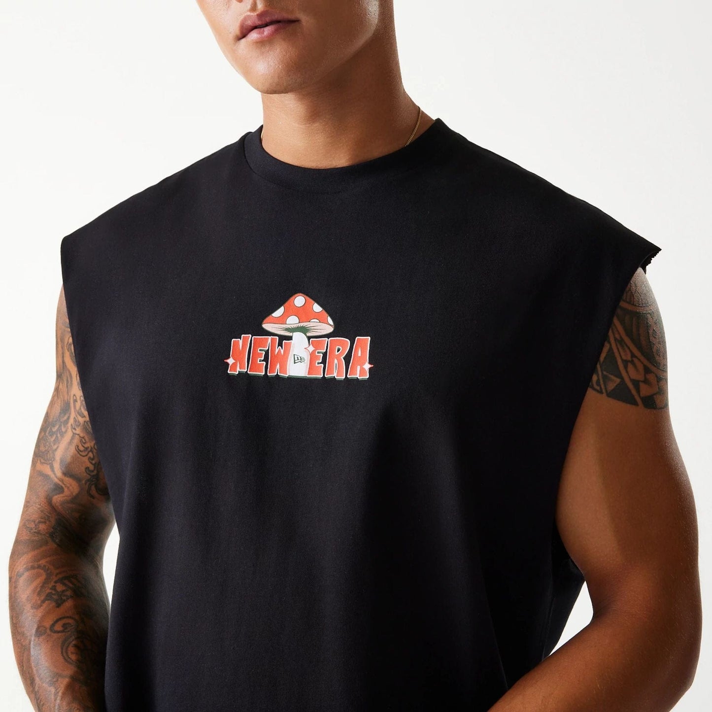 The Male model is wearing New Era Outdoor Graphic Black Sleeveless T-Shirt 3