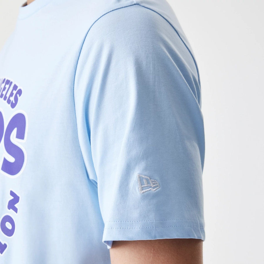 The Male model is wearing LA Lakers NBA Bubble Wordmark Pastel Blue T-Shirt 5