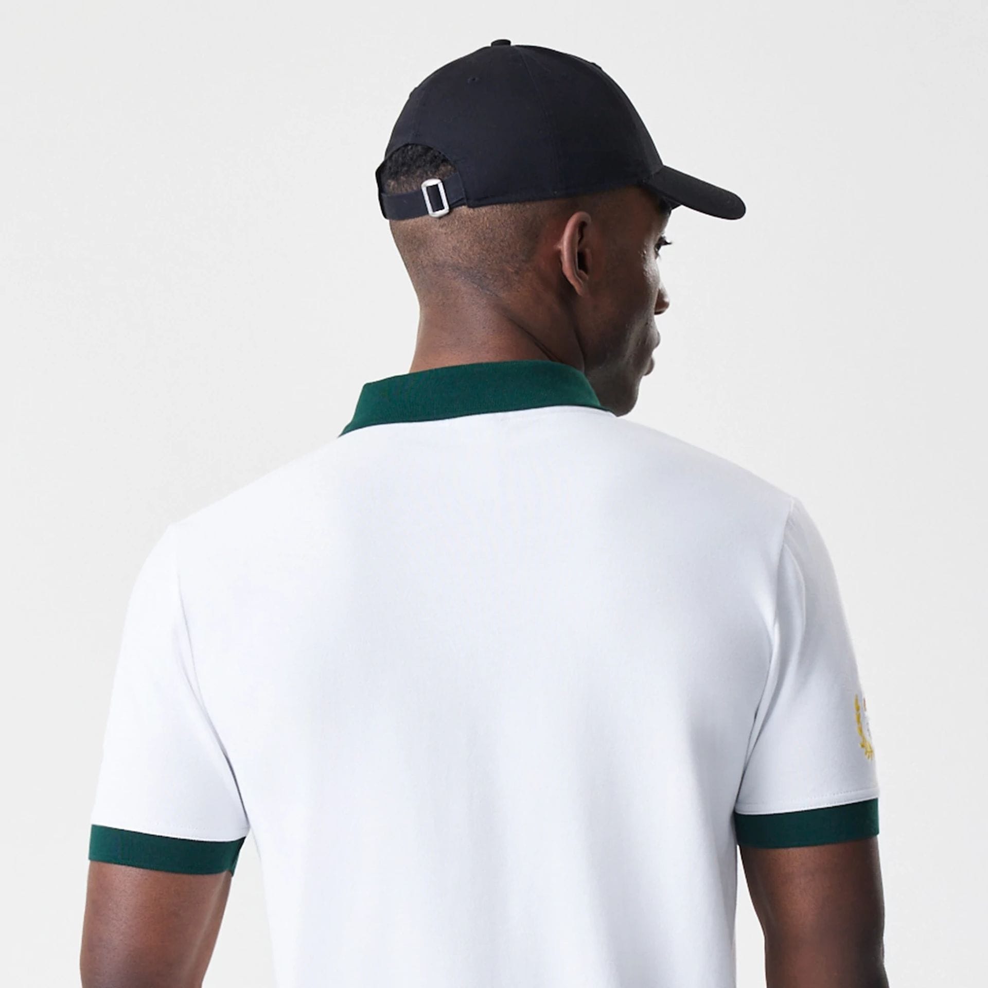 The Male model is wearing Caddyshack BushWood White Polo T-Shirt 7