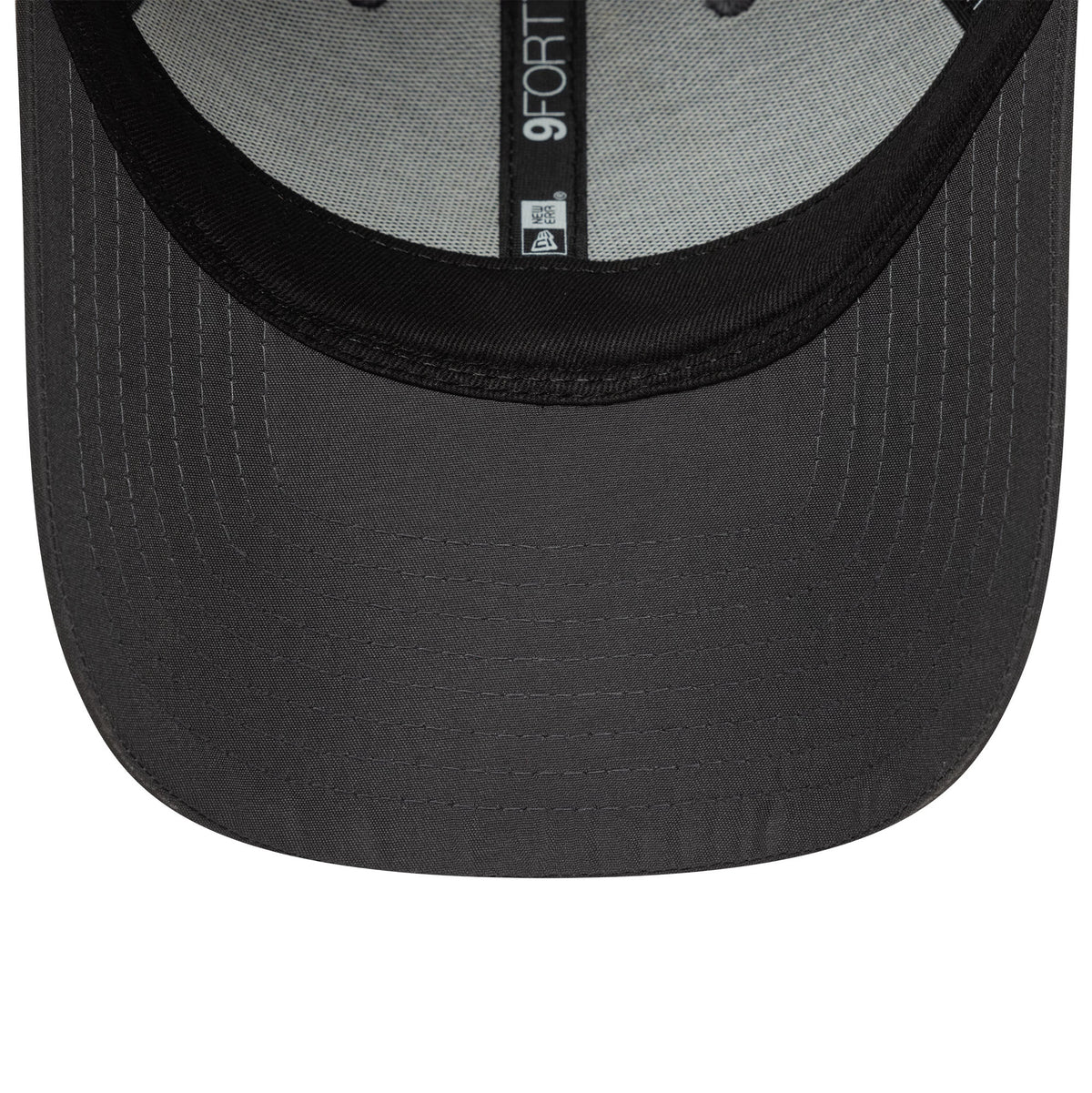 New York Yankees MLB Flawless Dark Grey New Era 9FORTY Adjustable Cap, inside view showing grey taping with a 9FORTY size sticker on the underside of the dark grey visor and black sweatband.