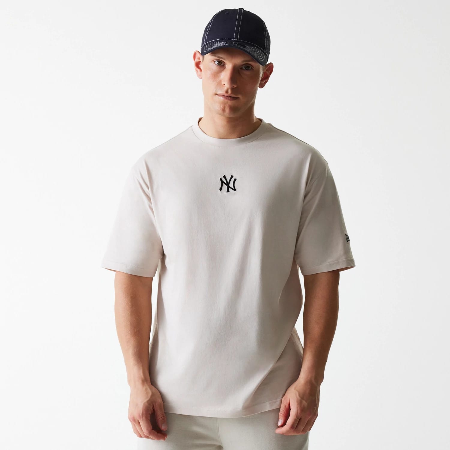 The Male model is wearing New York Yankees MLB League Essential Cream Oversized T-Shirt 1