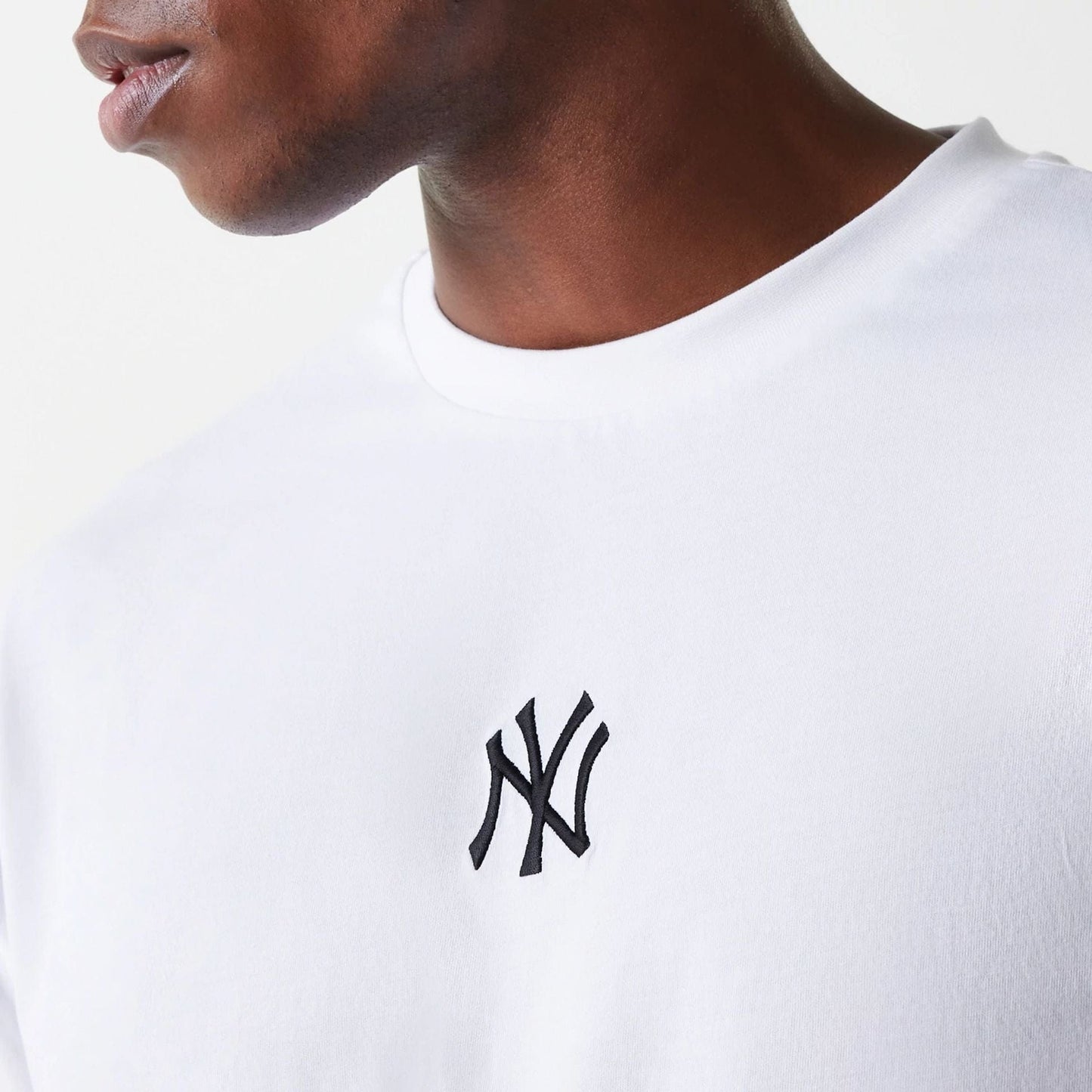 The Male model is wearing New York Yankees MLB League Essential White Oversized T-Shirt 4