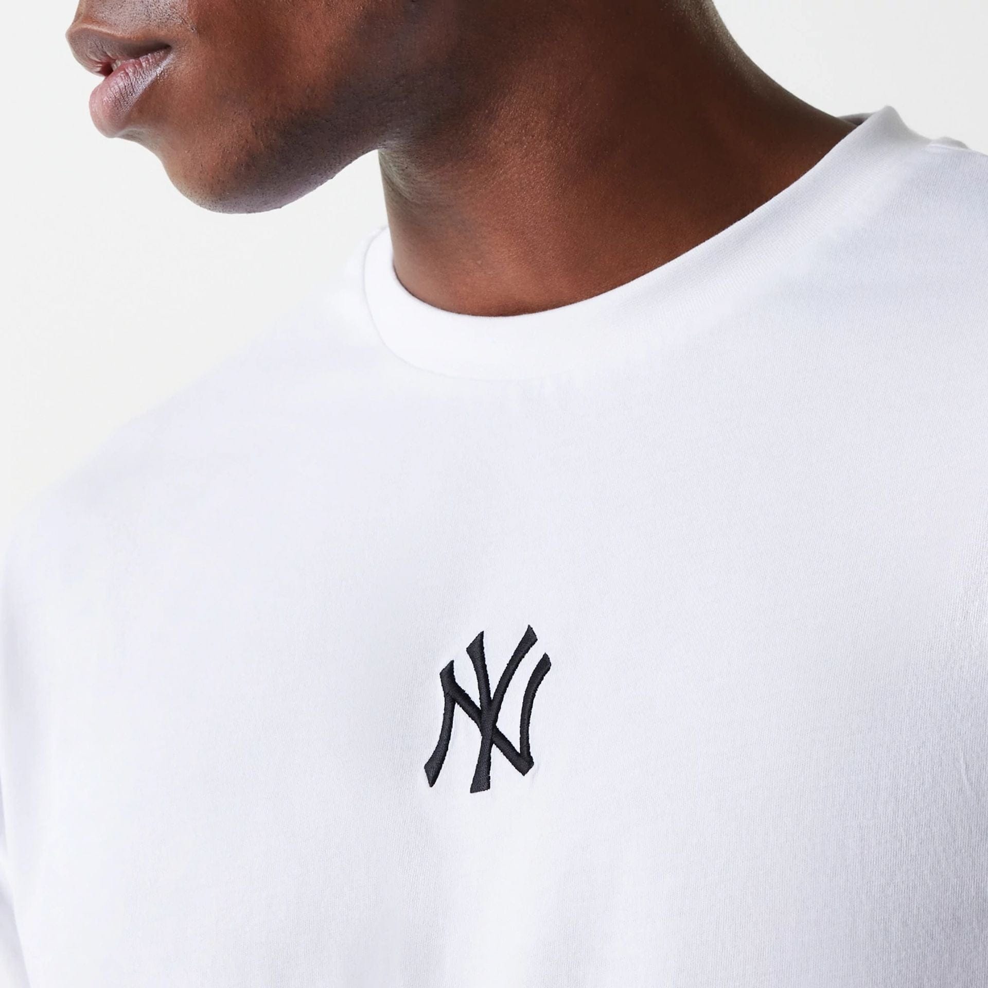 The Male model is wearing New York Yankees MLB League Essential White Oversized T-Shirt 4