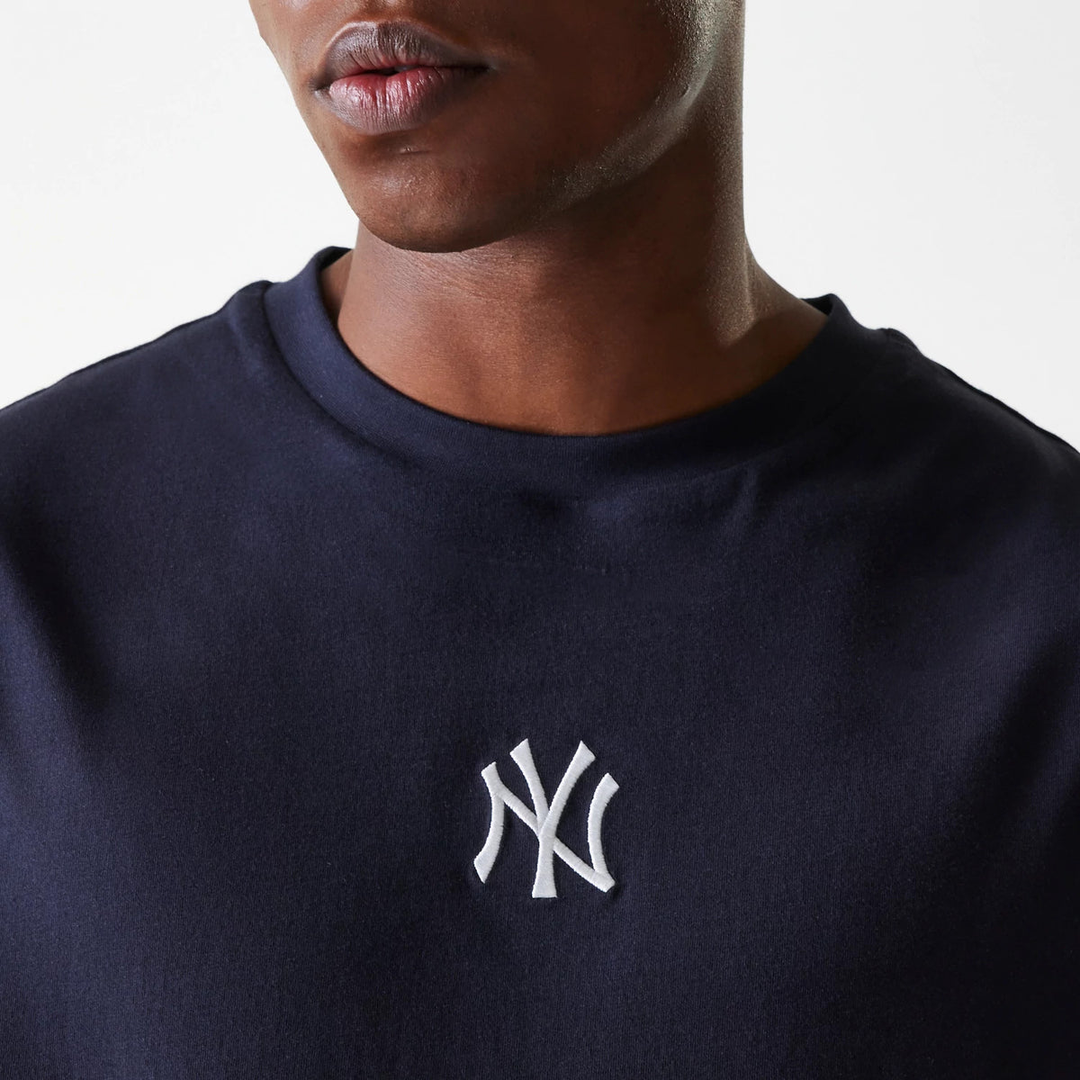 The Male model is wearing New York Yankees MLB League Essential Navy Oversized T-Shirt 4