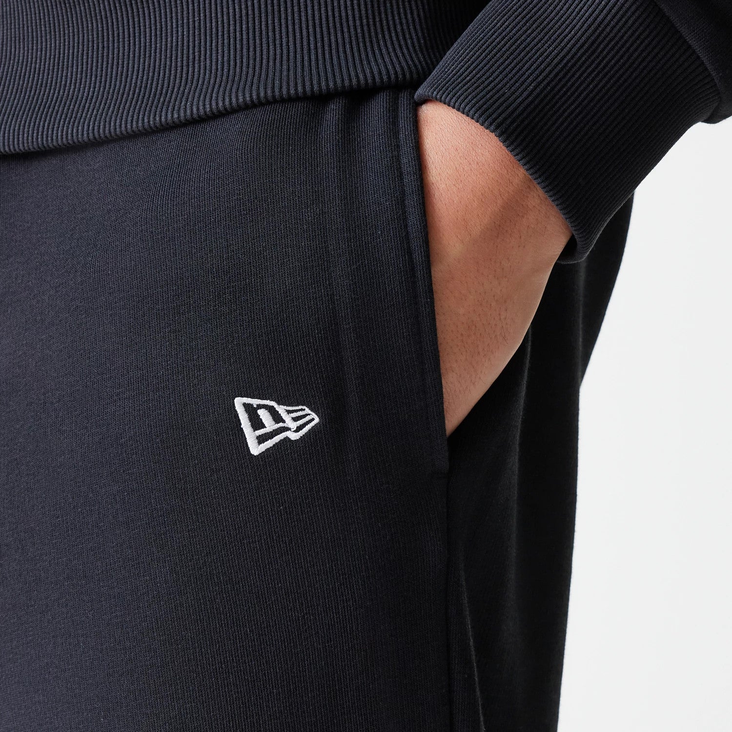 The Male model is wearing New York Yankees MLB League Essential Midi Black Joggers 5