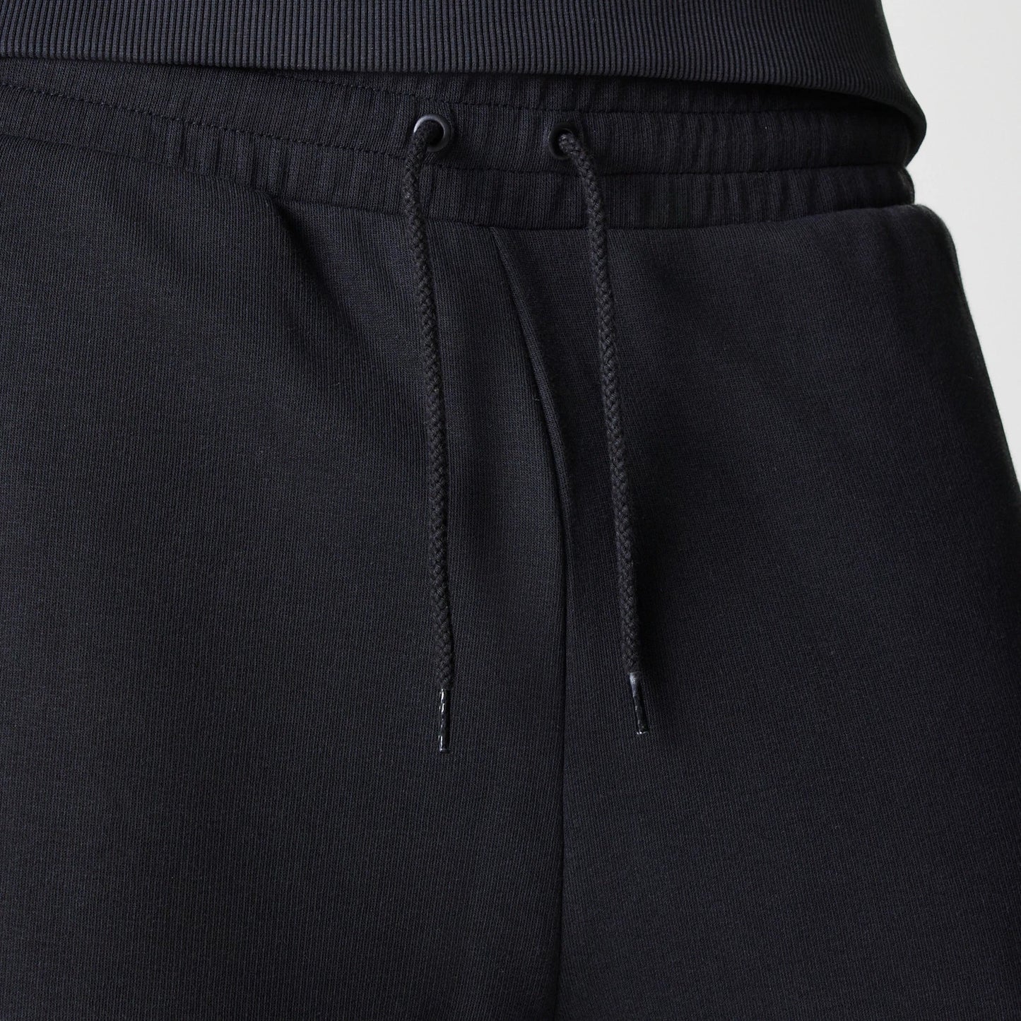 The Male model is wearing New York Yankees MLB League Essential Midi Black Joggers 6