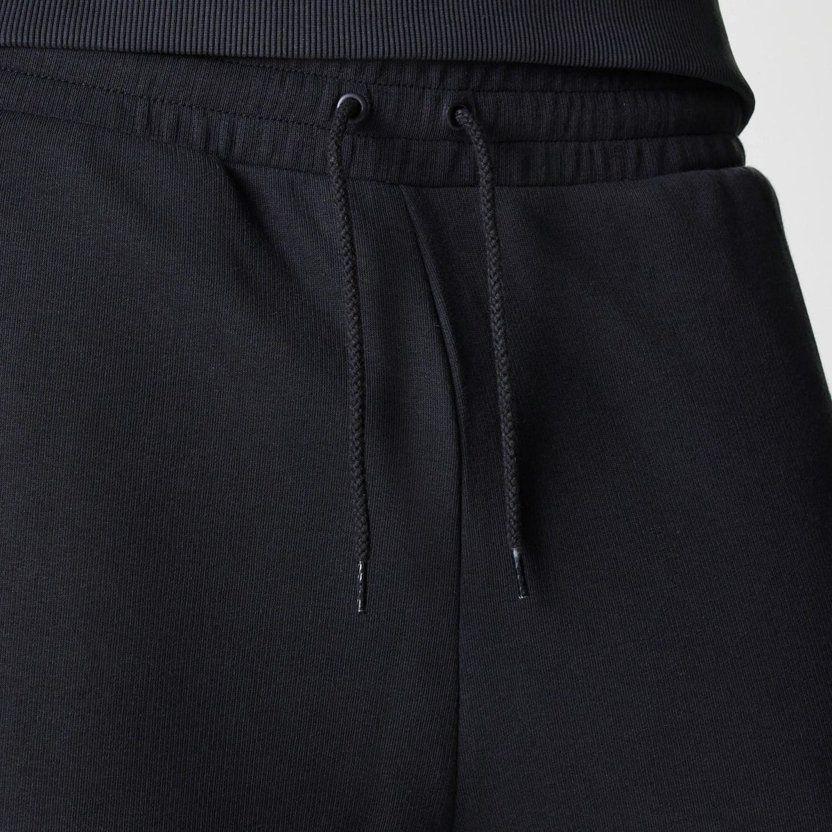 The Male model is wearing New York Yankees MLB League Essential Midi Black Joggers 6