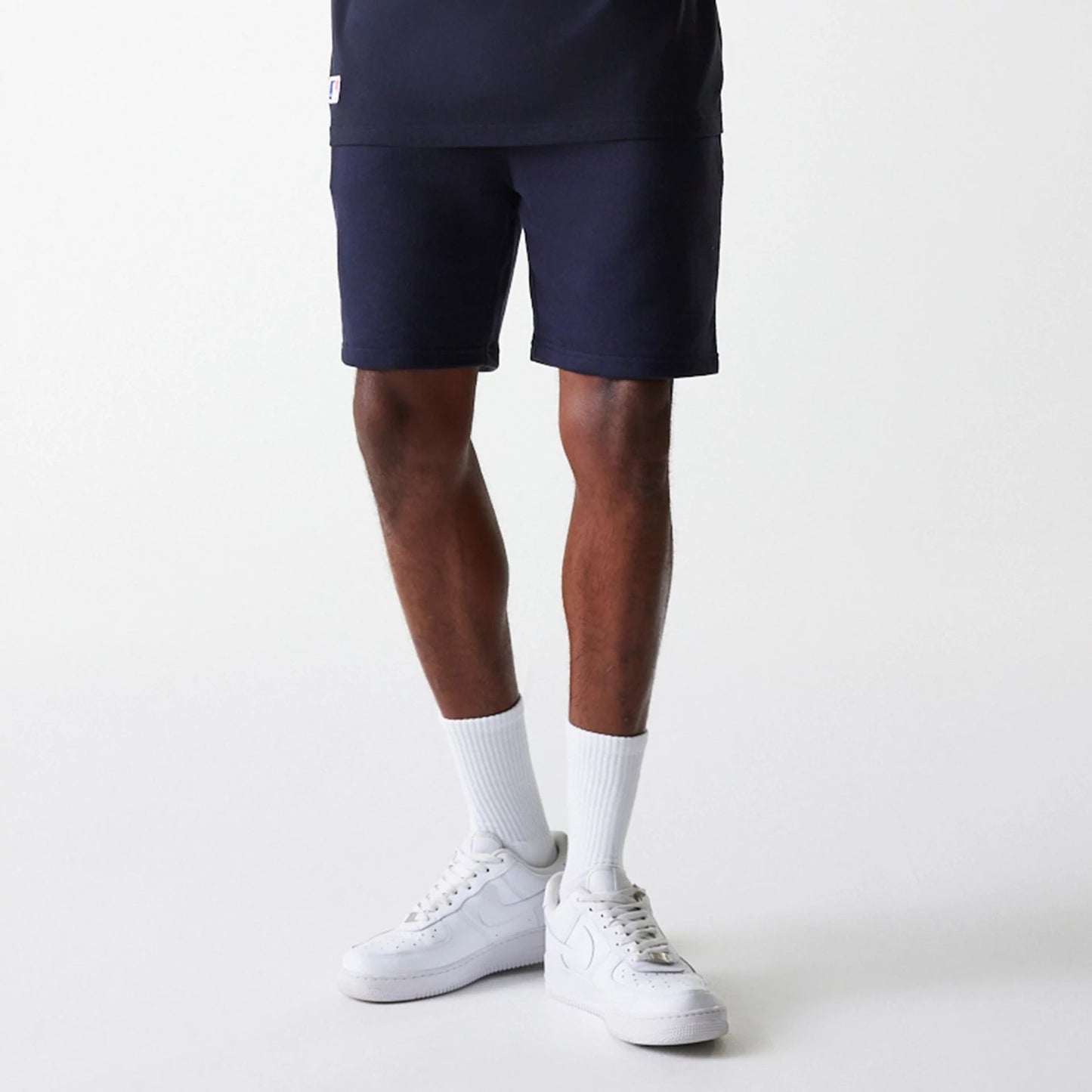 The Male model is wearing New York Yankees MLB League Essential Navy Shorts 3