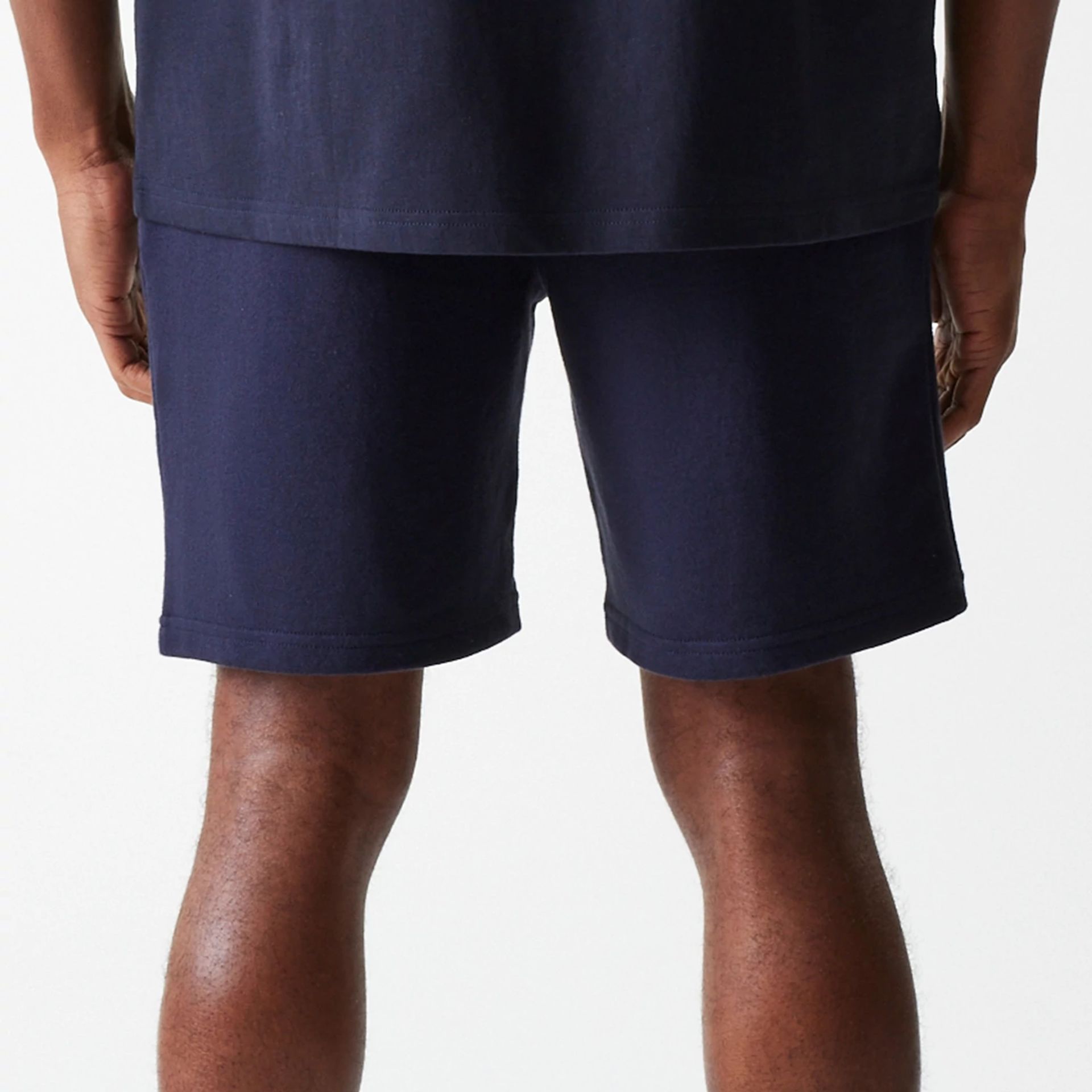 The Male model is wearing New York Yankees MLB League Essential Navy Shorts 7