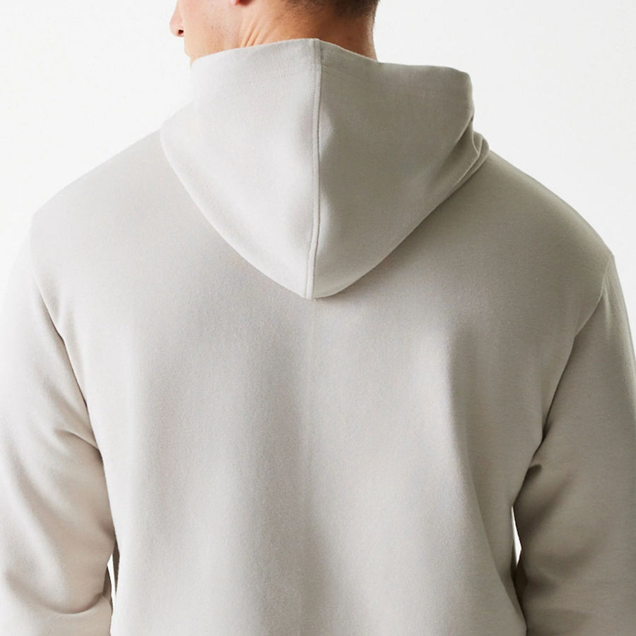 The Male model is wearing New York Yankees MLB League Essential Midi Cream Oversized Pullover Hoodie 7